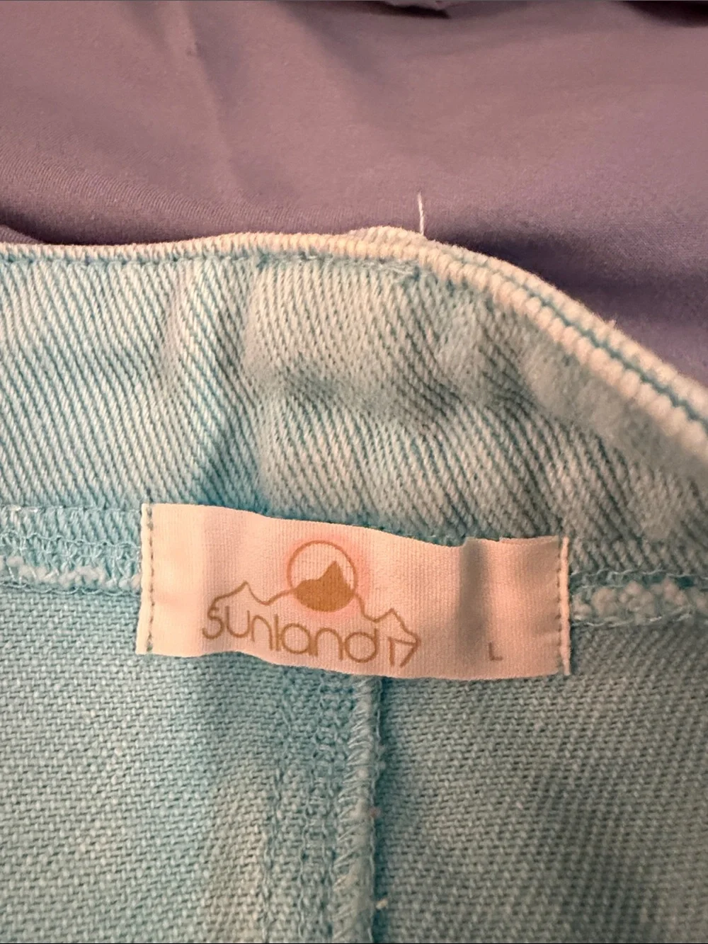 Light Blue Denim Mini Skirt with Frayed Hem